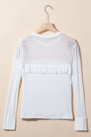 White long sleeve bodysuit with pearl-embellished mesh yoke and ruffled detail.