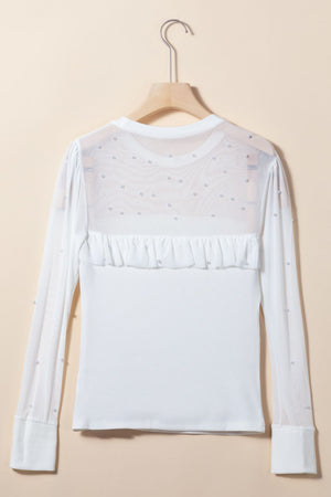 White long sleeve bodysuit with pearl-embellished mesh yoke and ruffled detail.