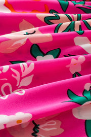 Hot pink blouse with a white and green floral print.