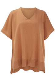 Relaxed V-neck knit poncho top in Caramel with short sleeves and ribbed hem.