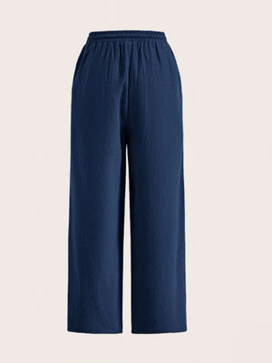 Navy linen wide-leg drawstring trousers with elastic waistband and textured fabric.