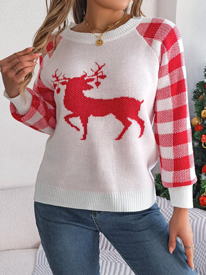 White sweater with red reindeer graphic and red gingham sleeves.