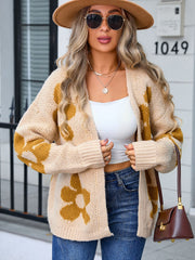 Tan floral intarsia open-front knit cardigan with crew neck and long sleeves.