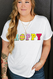 White t-shirt with sequin "Hoppy" graphic featuring an Easter egg.