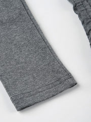 Grey ruched bodycon mini dress sleeve detail with ribbed texture and drawstring.