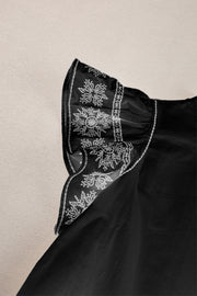 Black embroidered sheer sleeve blouse with ruffle neckline detail.