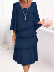 Dark blue tiered dress with 3/4 bell sleeves and a scoop neck.
