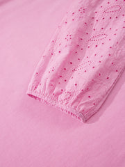 Pink cotton crew-neck sweatshirt with embroidered eyelet detail on the sleeve cuff.