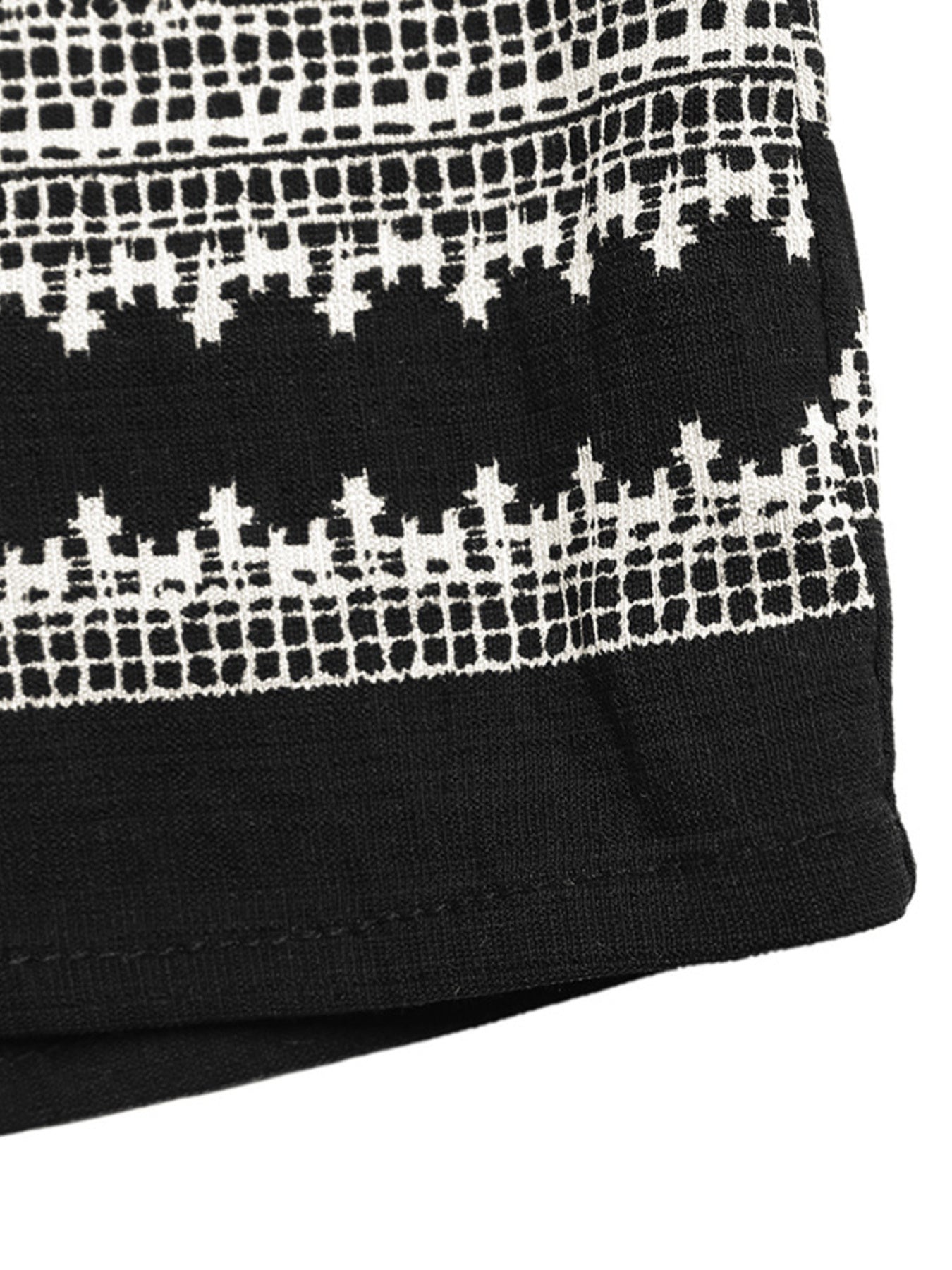 Black sleeveless top with white geometric print detail and solid hem