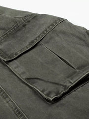Green wide-leg cargo pants with visible stitching and large flap pockets.