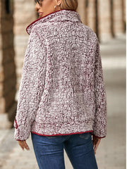 Sherpa jacket in burgundy with crimson piping and a fuzzy texture.