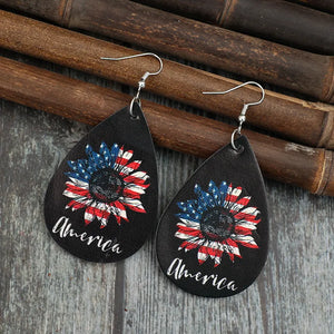 Black teardrop earrings with American flag sunflower design and "America" text