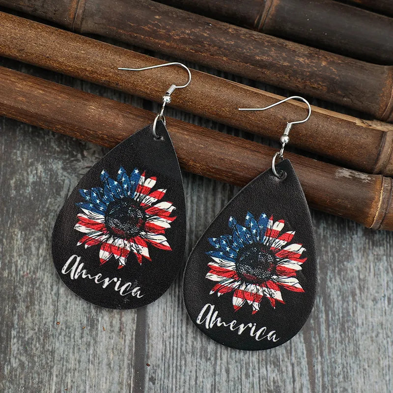 Black teardrop earrings with American flag sunflower design and "America" text