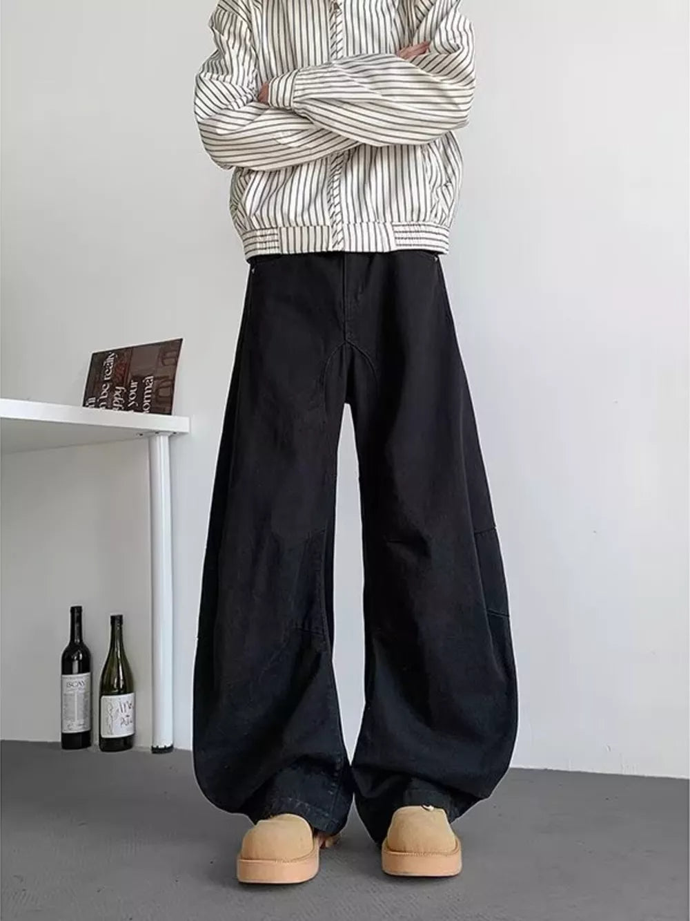Earthy black men's oversized sweatpants with pockets, featuring a baggy fit and casual style.