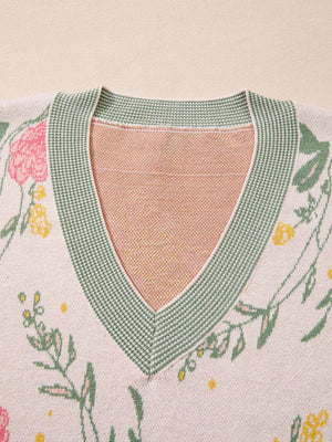 Floral V-neck knit sweater with green trim and relaxed fit.