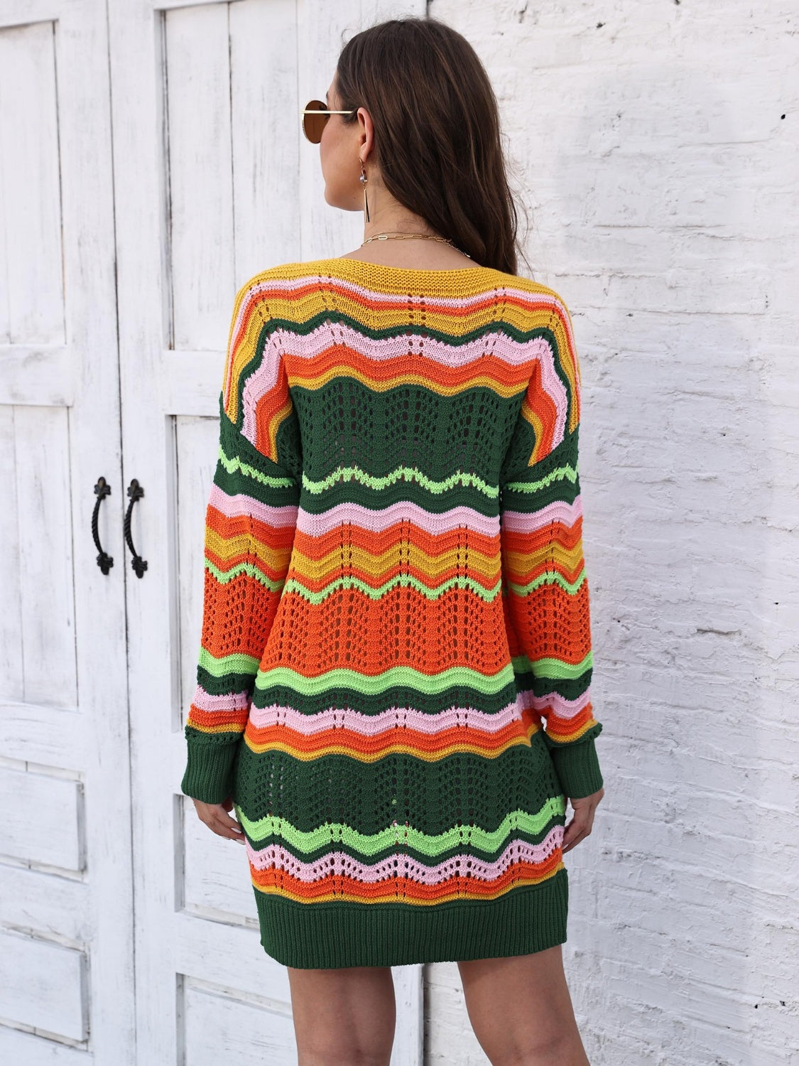Chevron stripe knit mini dress with crochet details in orange, green, pink, and yellow.