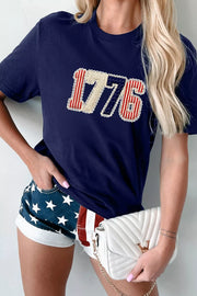 Navy cotton t-shirt with patriotic 1776 appliqué and round neck.