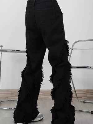 Men's black wide-leg jeans with fringe trim detail