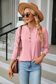 Pink textured henley blouse with button detail and long sleeves