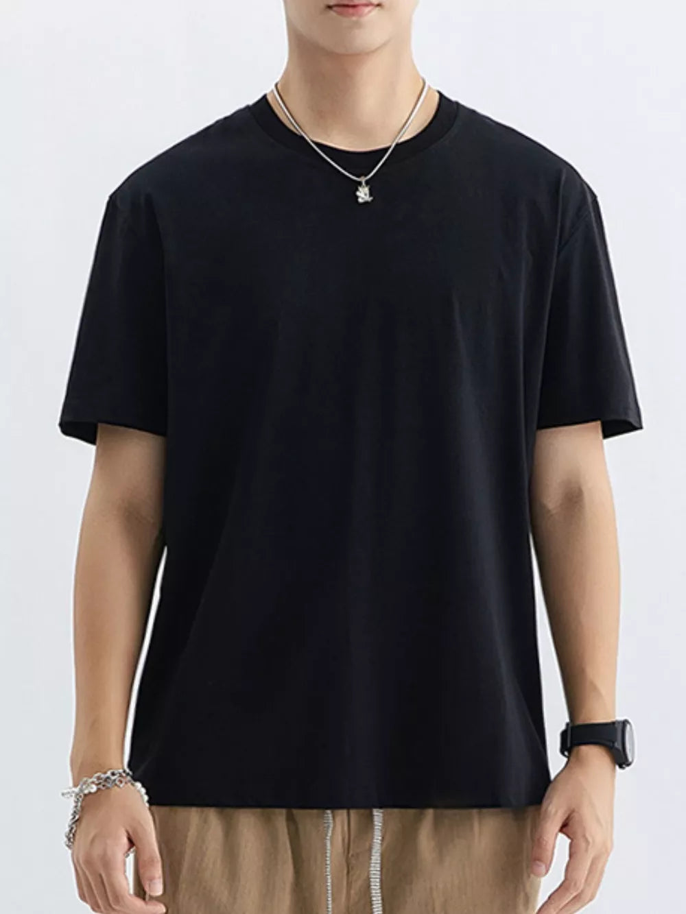 Men's black cotton crew neck t-shirt with short sleeves.