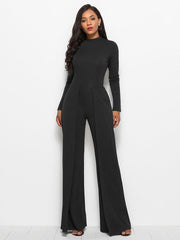 Black high-waisted palazzo jumpsuit with long sleeves and front slit pants.