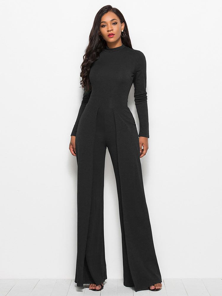 Black high-waisted palazzo jumpsuit with long sleeves and front slit pants.
