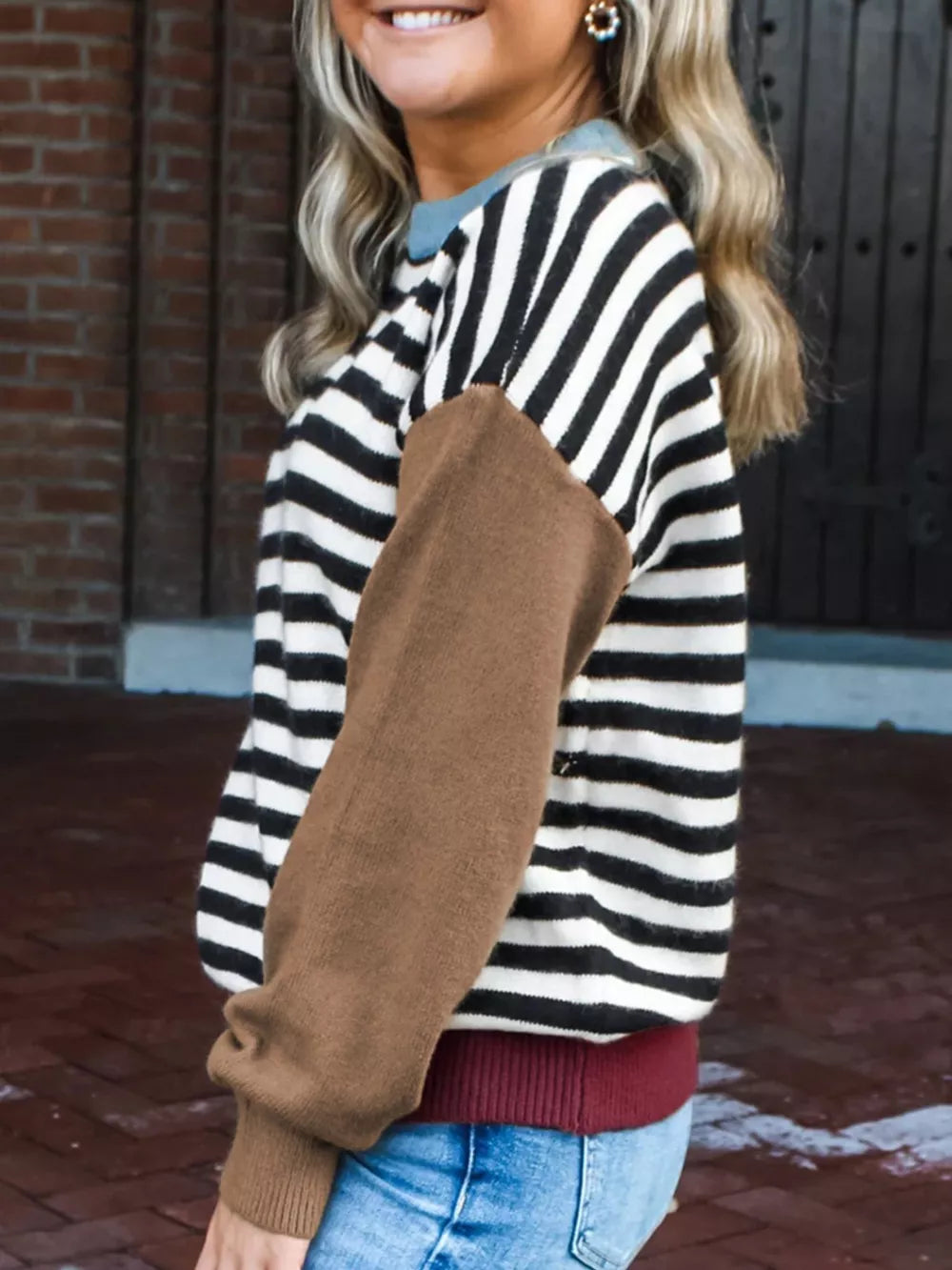 Colorblock striped knit sweater with brown sleeves and a crew neck.