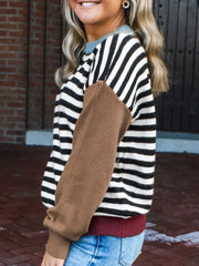 Colorblock striped knit sweater with brown sleeves and a crew neck.