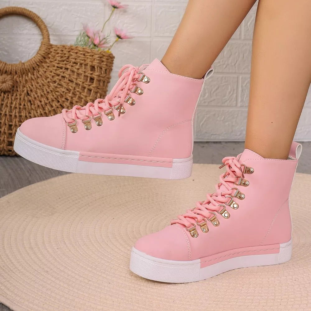 Pink lace-up platform sneakers with D-ring eyelets and white soles.