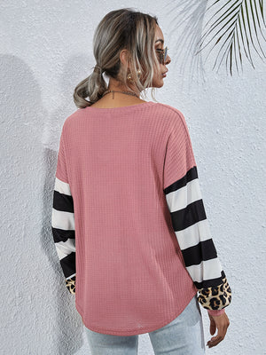 Waffle knit blush pink top with striped and leopard print sleeves