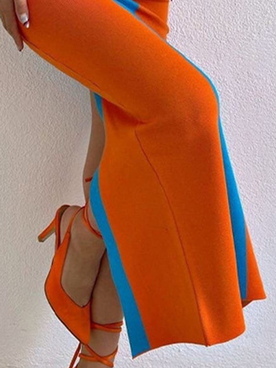 Orange and blue contrast panel bodycon maxi dress with a side slit.