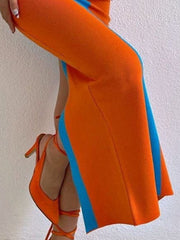 Orange and blue contrast panel bodycon maxi dress with a side slit.