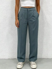 Chic high-waisted pleated maternity pants in slate blue with button closure and wide leg.