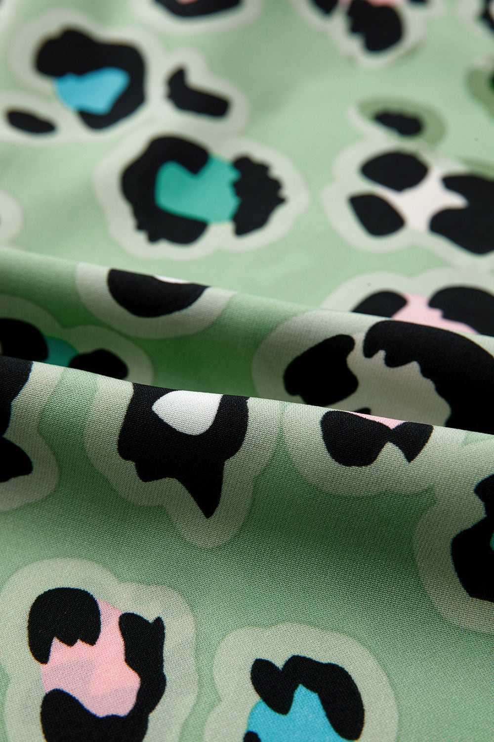 Sage leopard print resort shirt and trousers fabric detail