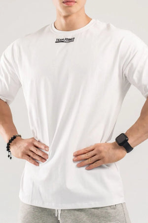 White oversized t-shirt with black logo detail on the chest.
