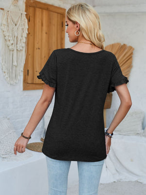 Black t-shirt with flutter sleeves and a scoop neckline, styled casually.