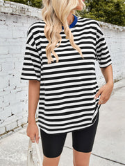 Black and white striped relaxed tee with a contrast blue neckline and short sleeves.