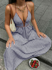 Striped maxi dress with halter neckline and deep v, featuring brown trim.