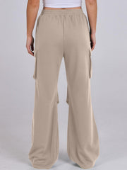 Tan sweatpants with cargo pockets and a wide leg silhouette.
