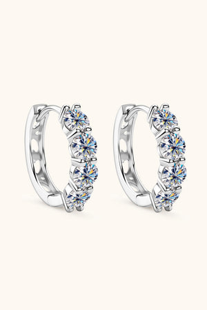 Silver pavé crystal huggie earrings with five round-cut stones each.