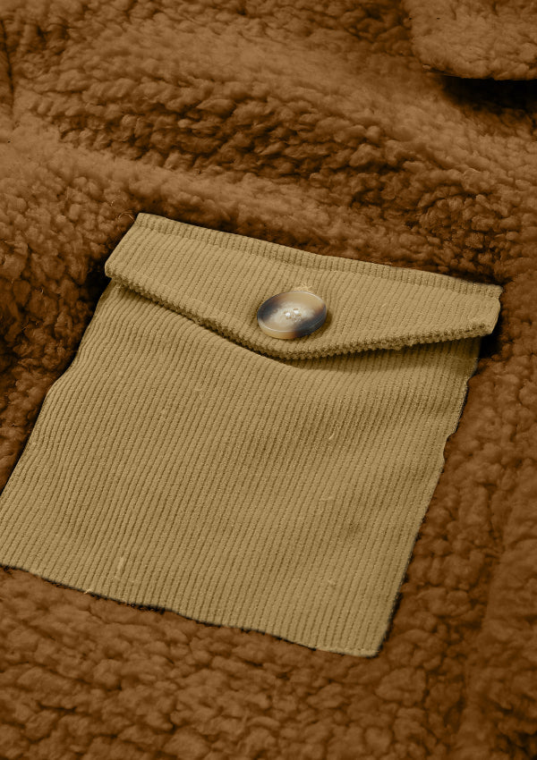 Brown sherpa coat with a tan corduroy patch pocket and button detail.