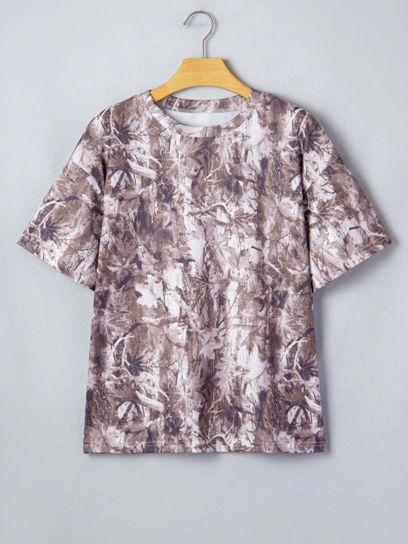 Woodland camouflage tunic with crew neck and short sleeves.
