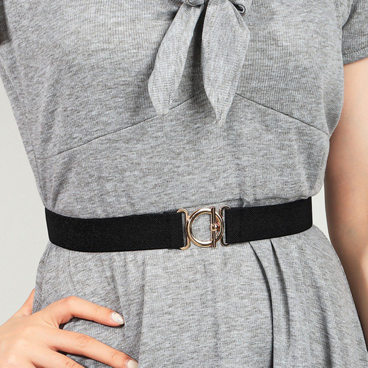 Black elasticated belt with gold circle buckle detail