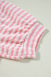 Textured stripe puff sleeve top in blush pink with a seersucker fabric detail.