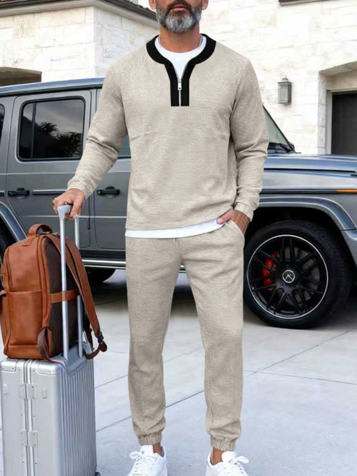 Apricot track pants set with zippered neckline, long sleeves, and elastic cuffs.