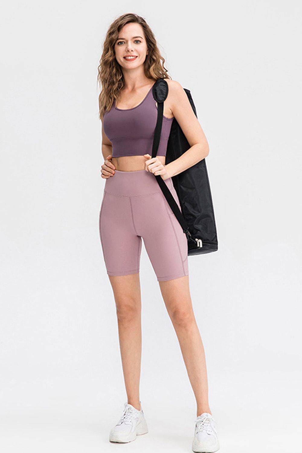 Sculpting pocketed cycling shorts in lavender with a high waist and seamless sides.