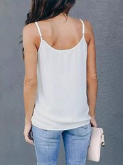 White cami top with adjustable straps and a V-neck detail.