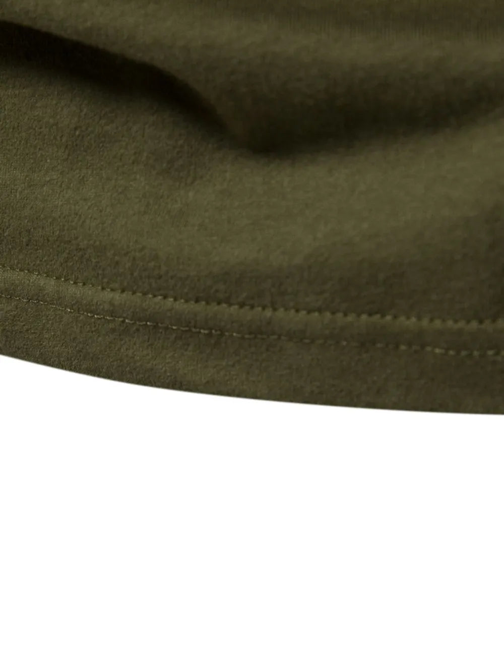 Army green raglan tee detail showing double-stitched hem and soft fabric texture.