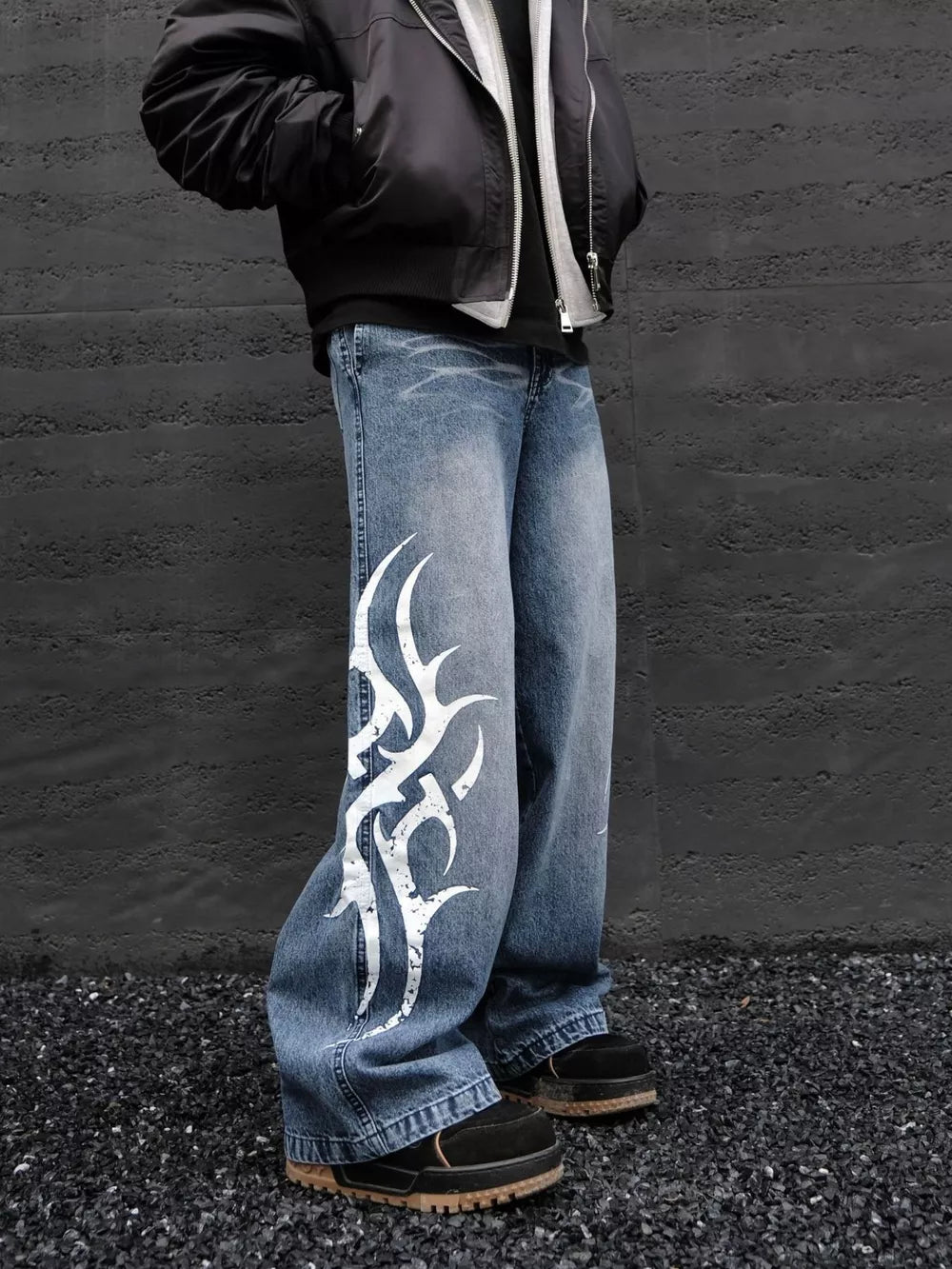 Men's blue denim wide leg jeans with tribal print detail