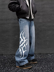 Men's blue denim wide leg jeans with tribal print detail